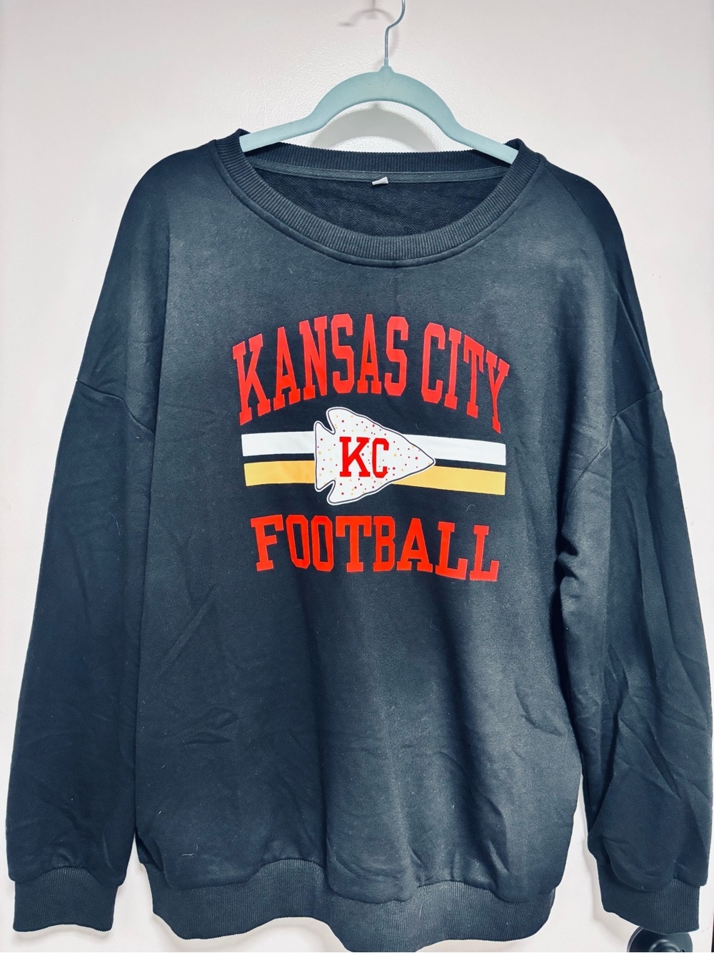 Black Kansas City Football Pullover with Red and Yellow Graphic